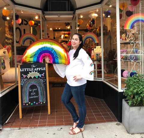 The Little Apple owner Brandy Deieso in front of shop on 6th anniversary.