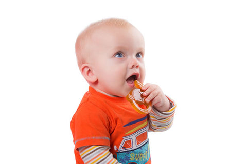Baby holding non-toxic teething toy