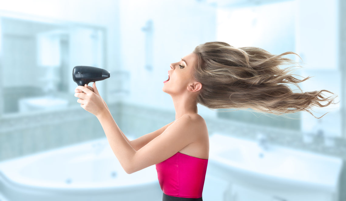 woman holding hair dryer - model image