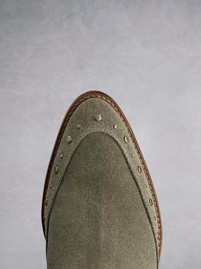 Emilia in khaki suede, with stud detailing that highlights the almond toe shape.