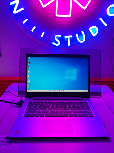 Windows 10 PC Laptop on top of RISO Machine