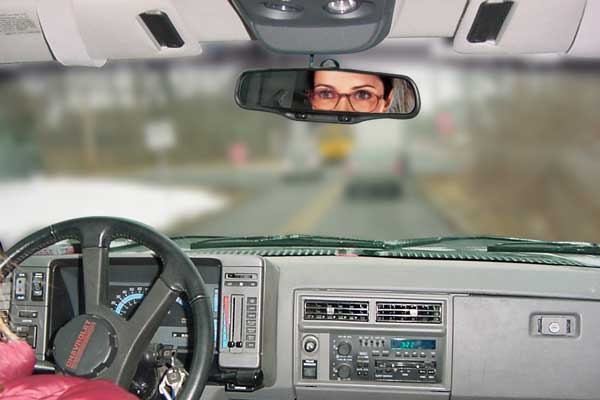 Person driving wearing normal reading lenses - car dashboard is in focus while far away objects are blurry