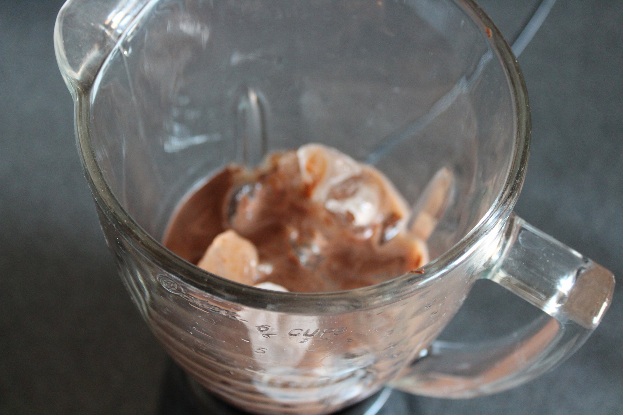 Add mixture to blender with ice and mix 