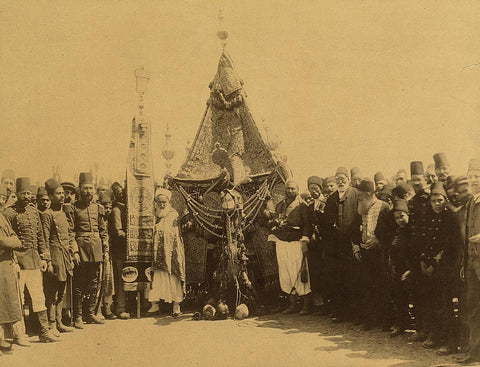 ca. 1903, December 14. Soldiers and dignitaries after leaving Damascus, Syria, for the Hajj seen carrying the Mahmal (the Holy Carpet) or the emblem of the Ottoman Emperor. 