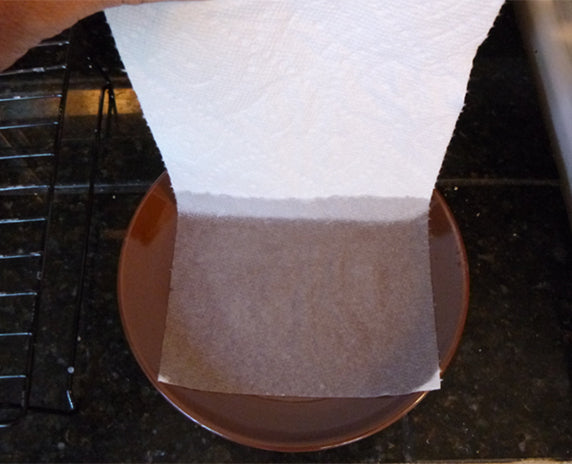 Dipping paper towel in fire retardant baking soda solution