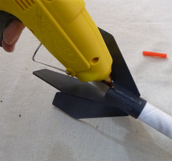 Hot gluing guide tube straw onto rocket body