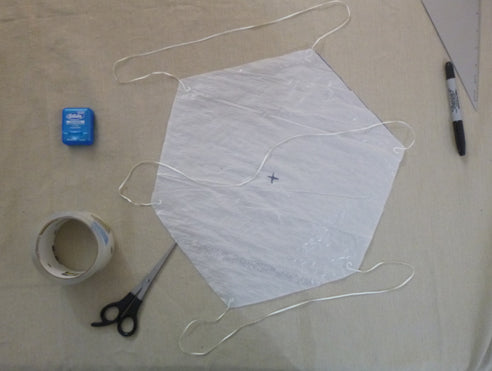 Dental floss taped to parachute corners