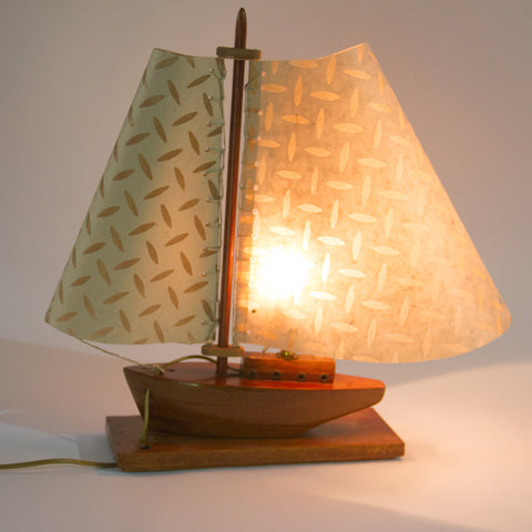We made the sails on this model boat lamp and even did the sewn rigging