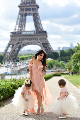 mother and daughters with Eiffel Tower in the background