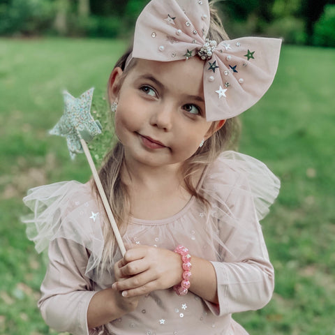 cutie in tutu with big bow and fairy wand