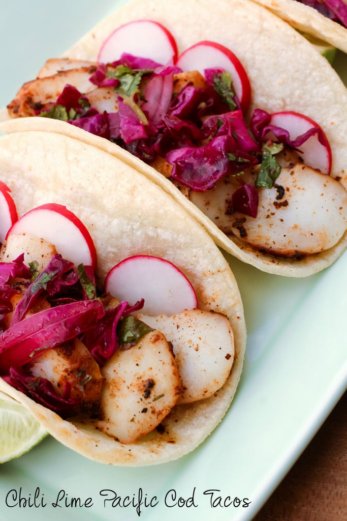Chili Lime Pacific Cod Tacos ~ Spice rubbed and skillet cooked Pacific cod tossed with fresh lime juice in a fresh flame kissed corn tortilla and topped with a simple cabbage and cilantro slaw for the perfect south-of-the-border tasting experience. 