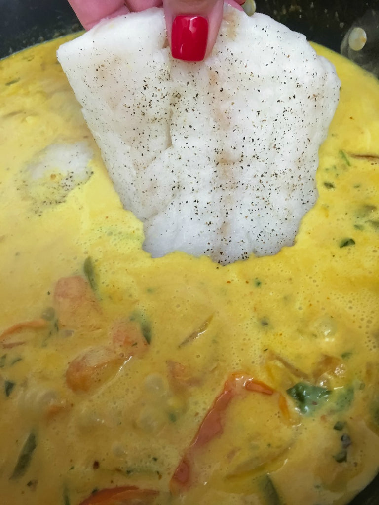 Goan Inspired Pacific Cod Curry ~ Subtly sweet from coconut milk, this Goan inspired curry is rich, creamy, and mildly spiced, poaching the pacific cod with tomatoes, onions, and peppers.