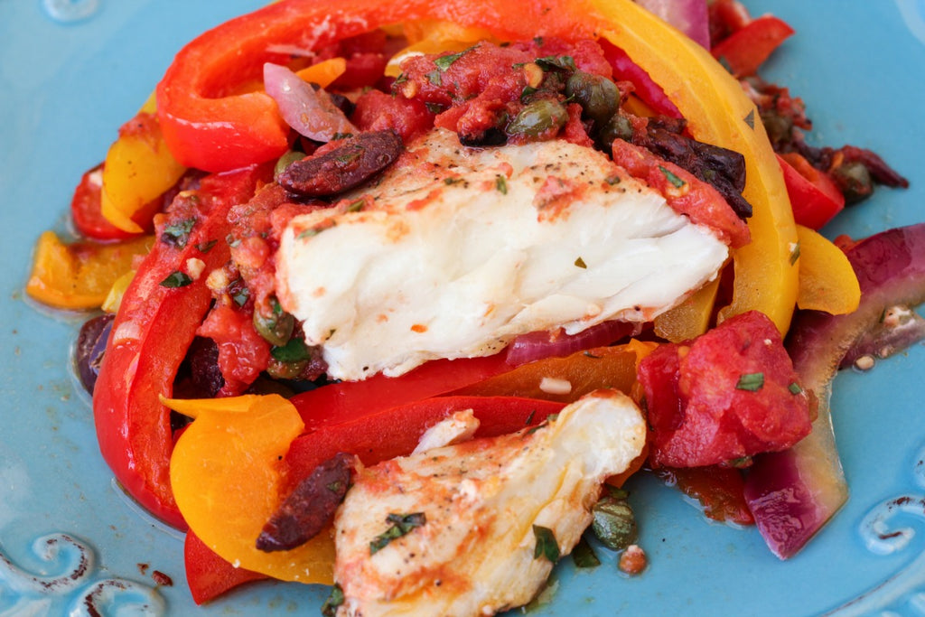 Mediterranean Halibut ~ Oven baked Mediterranean style halibut with fresh bell peppers, onions, capers, and kalamata olives. 