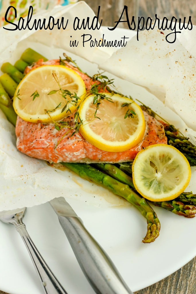Salmon and Asparagus in Parchment ~ Sockeye Salmon delicately seasoned with salt and pepper upon stalks of crisp asparagus, topped with lemon slices and fresh thyme, sealed in parchment paper for a succulently easy and elegant dinner option. 