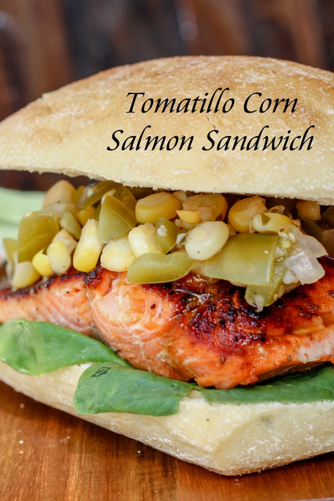 Tomatillo Corn Salmon Sandwich combines unique ingredients like a tomatillo corn relish, sustainable sockeye salmon, and Old Bay seasoning for one tasty nosh. 