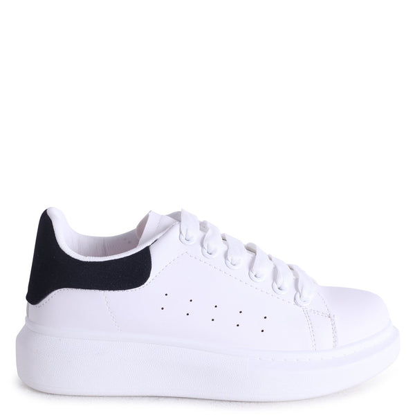 white trainers with black back