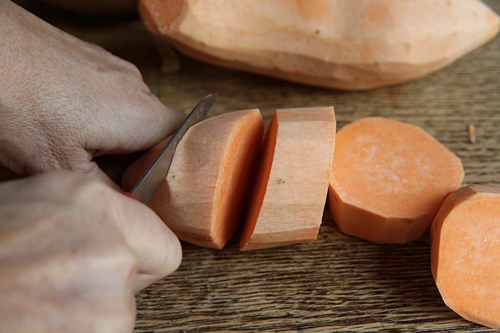 Cutting Sweet potatoes for casserole baked in the Fontana wood-fired oven 