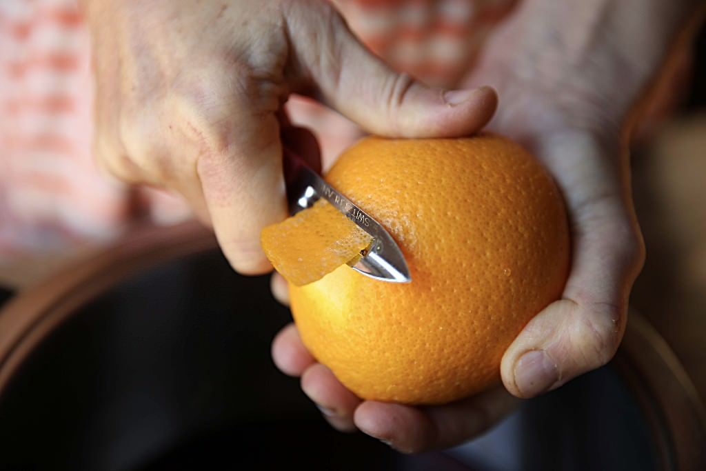 Orange rind to be cooked down with cranberries in wood-fired oven