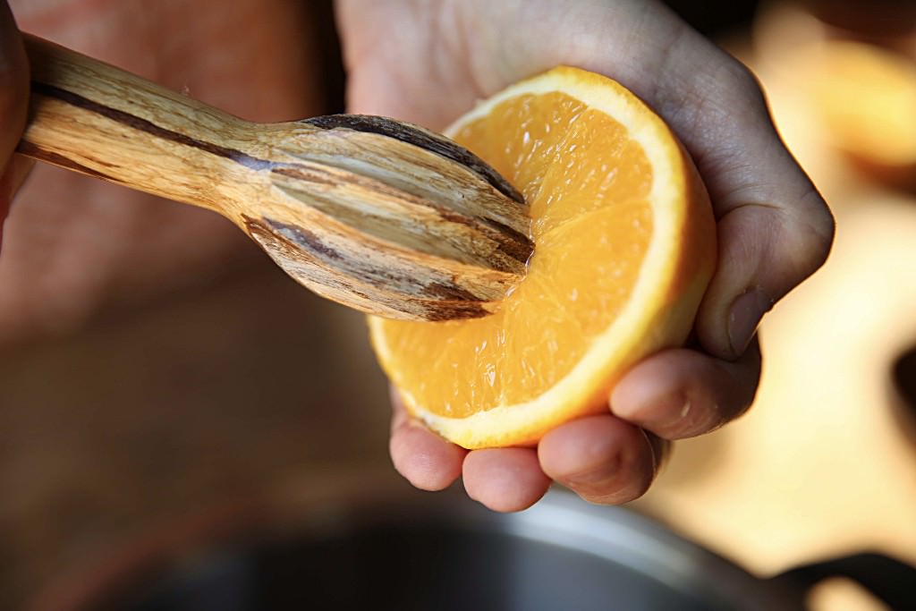 Orange juice to be cooked down with cranberries in wood-fired oven