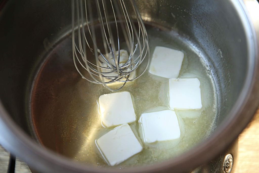 Melting butter for cheesy sauce for mac and cheese baked in fontana wood-fired oven