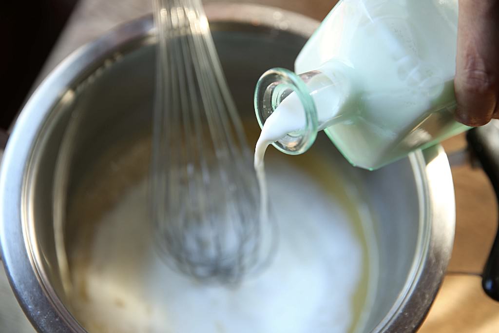 Milk for bechamel sauce for mac and cheese baked in the Fontana wood-fired oven 