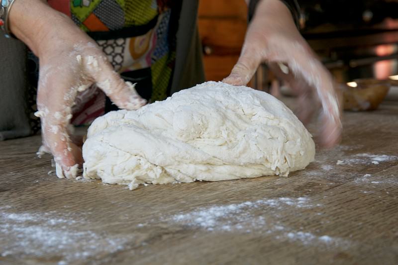 Begin kneading dough for bread baked in the Fontana wood-burning oven