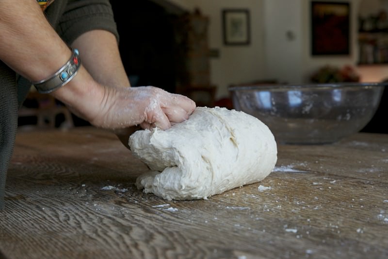 Knead dough for bread baked in the Fontana wood-burning oven