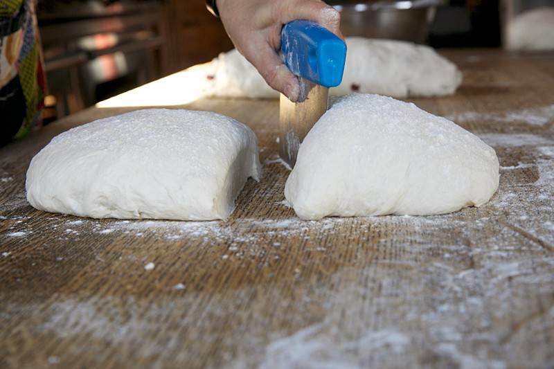 Divide the dough in half for bread baked in the Fontana wood-fired oven