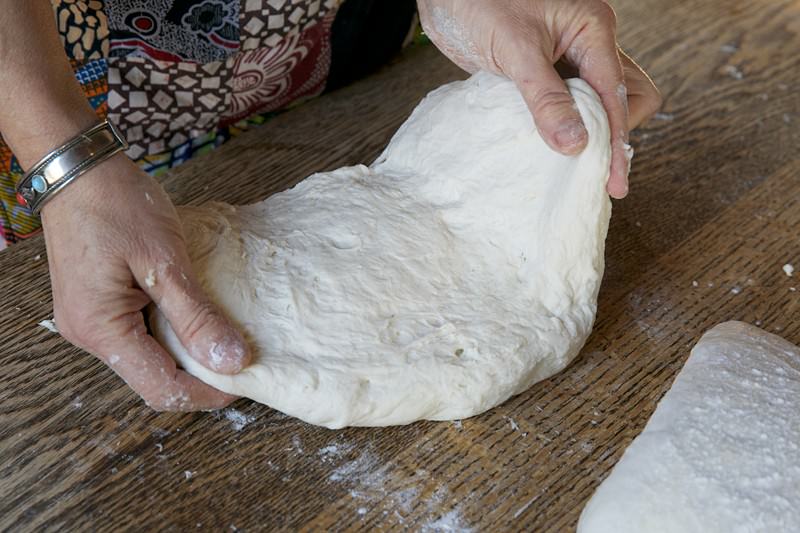 Shape the dough for bread baked in the Fontana wood-burning oven