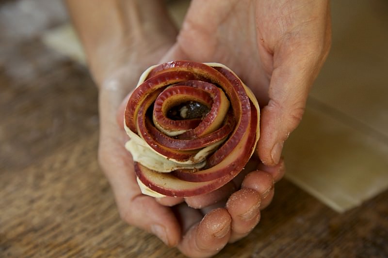 Apple roses with puffed pastry over apples and brown sugar to put in Fontana wood-fired oven 