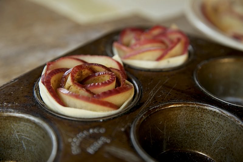 Apple roses with puffed pastry over apples and brown sugar to put in Fontana wood-fired oven 