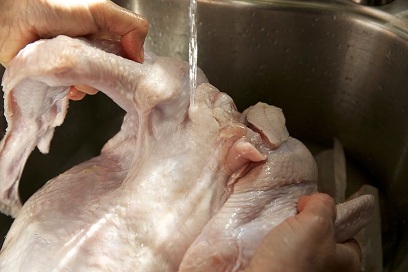 Rinse turkey before cooking in Fontana wood-burning oven 
