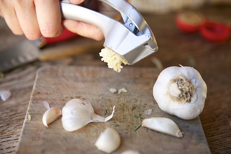 Garlic to be placed in brine for turkey to be baked in Fontana wood-burning oven 