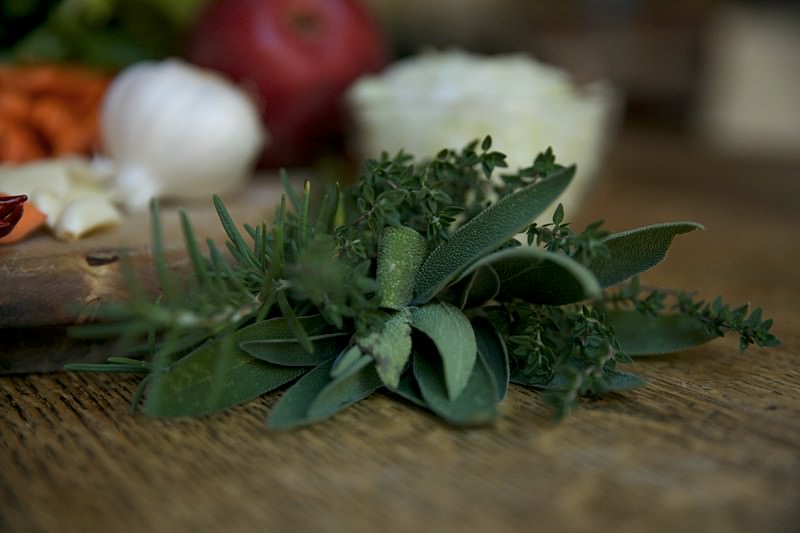 Herbs to be placed in turkey to be baked in Fontana brick oven 