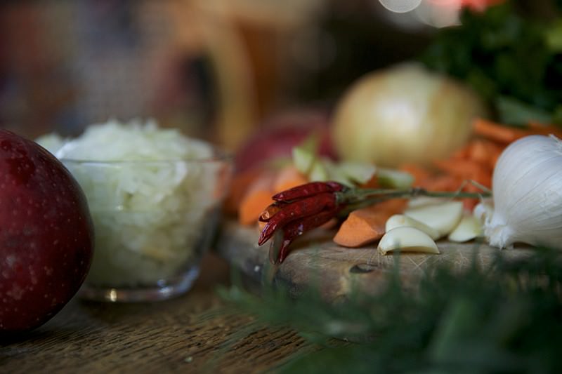 Herbs and vegetables to be placed in turkey to be baked in Fontana brick oven 