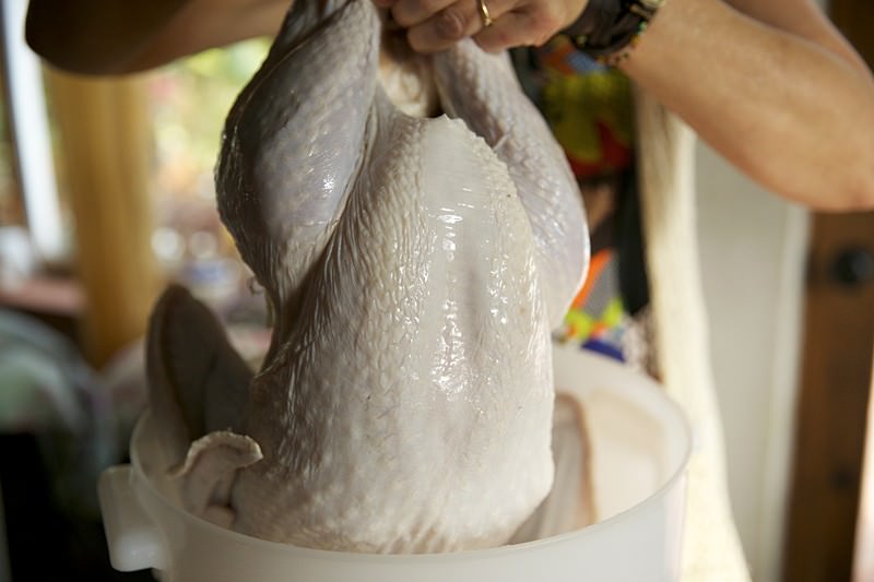 Take turkey out of ice brine to be baked in Fontana brick oven 