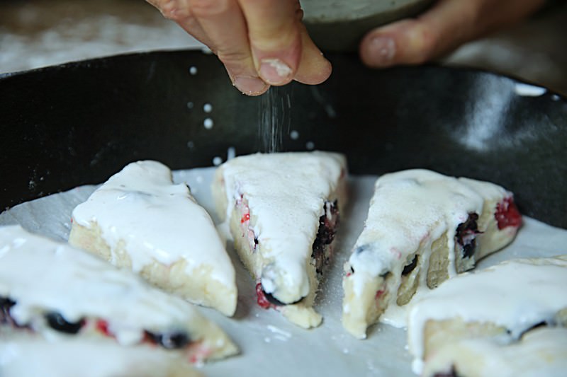 Sprinkle sugar over the top of the scones.