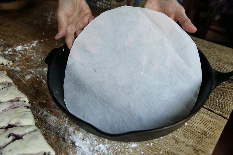 Place parchment paper in the bottom of the skillet.