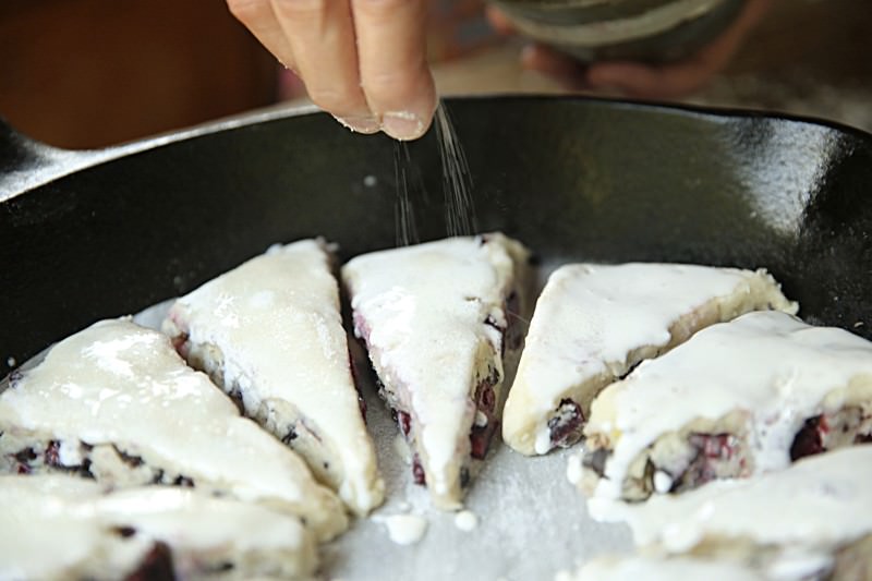 Sprinkle sugar over the top of the scones.