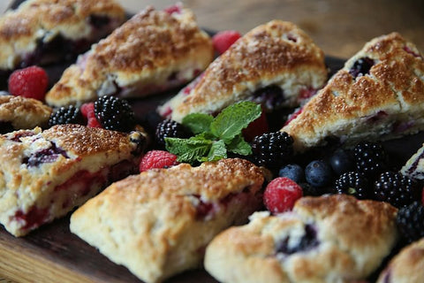 Place the scones on your favorite serving dish and garnish with fresh fruit and a sprig of mint.