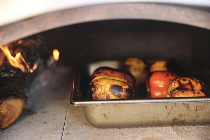 It is time to rotate the peppers by placing them on their side, in order to blacken them uniformally.