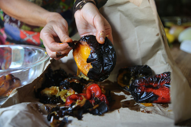 The paper bag did the job.  The peppers have been well steamed and allowed to sweat, thus allowing the skin to peel off very easily.