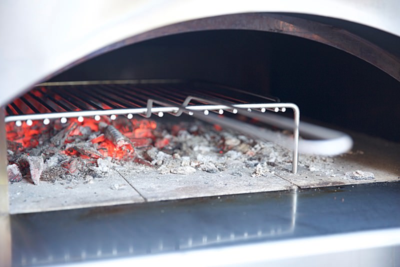 Place the stainless grill over the hot coals