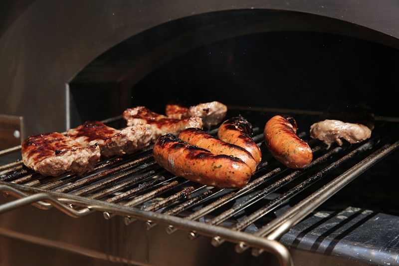 After 10 minutes take the stainless grill out of the oven and flip each piece of meat