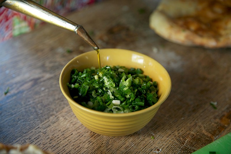 Drizzle a generous amount of good olive oil to the onions and butter