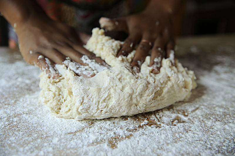 Carefully knead the dough into itself until it is no longer sticky