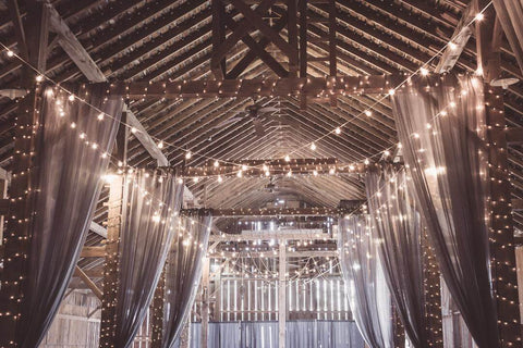 interior barn room all decorated with lights