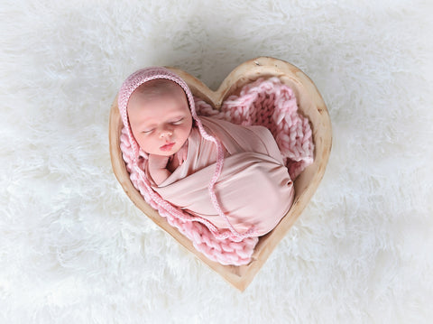 Pale pink newborn baby bonnet by Two Seaside Babes