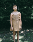 toddler girl wearing picnick kate ruffle dress, giraffe print