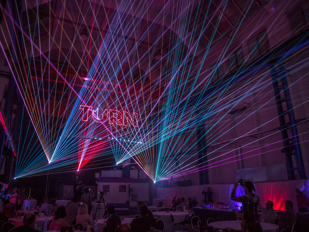 Corporate laser show with aerial laser beams and 3D laser text